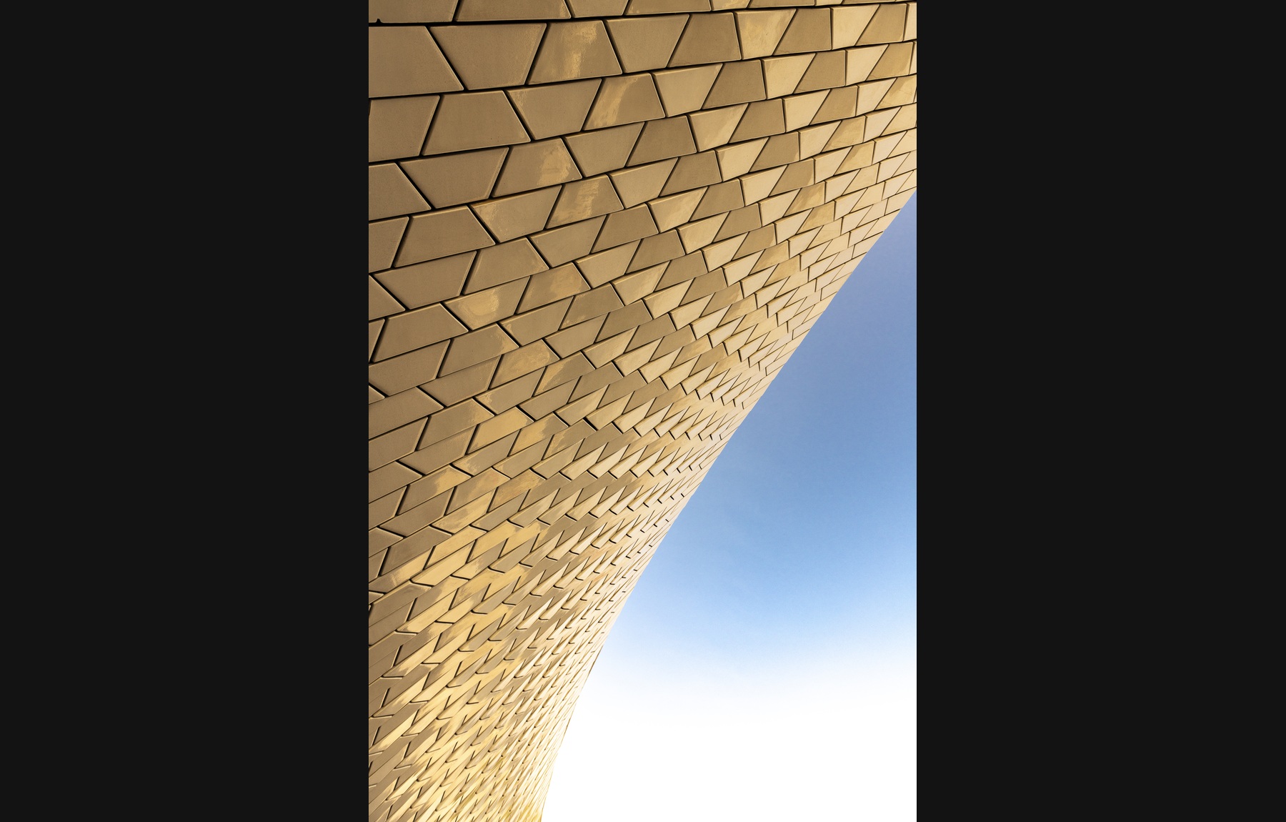 Golden architectural façade against a blue sky